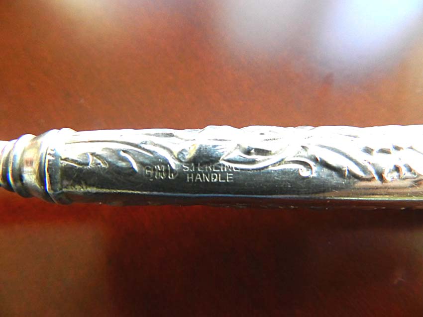  ,   - Sterling Handle Floral Repousse